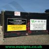 Vinyl signs on boards for commercial advertisement at the gates of a site entrance