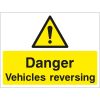 Danger vehicles reversing sign