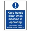 Keep hands clear when machine is operating sign