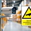 CCTV in operation sign on a perimeter fence warning of video surveillance